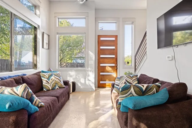 a living room with furniture and a large window