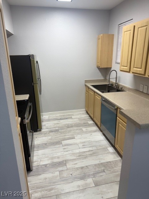 6955 North Durango Drive, Unit 1013 Las Vegas, NV 89149 - Photo 5 of 13 Kitchen featuring dishwasher, range, light brown cabinetry