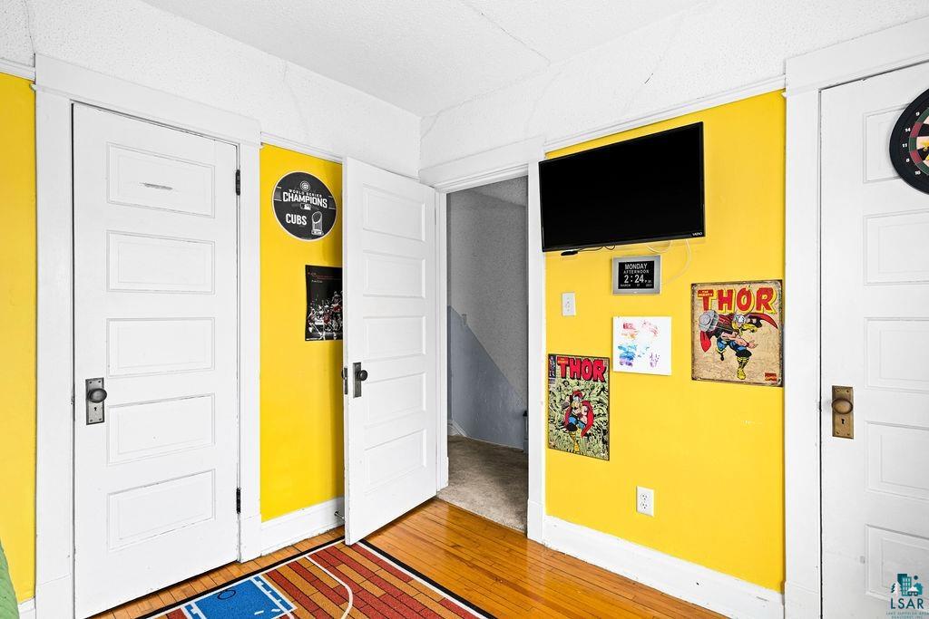 4608 Regent Street Duluth, MN 55804 - Photo 25 of 43 Bedroom featuring light wood-type flooring and baseboards