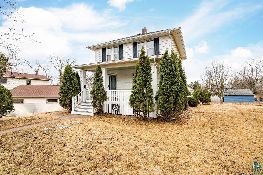 4608 Regent Street Duluth, MN 55804 - Photo 42 of 43 View of front facade featuring a porch and a chimney