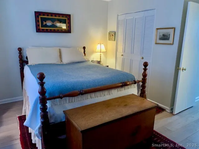 a bedroom with a bed and a area