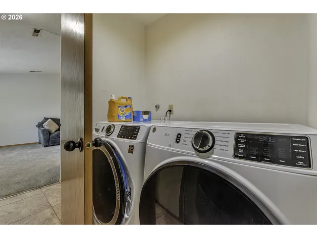 a utility room with dryer and washer