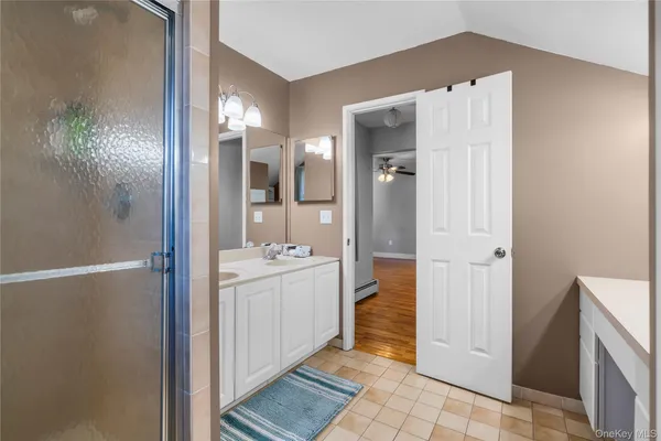 a bathroom with a sink and mirror