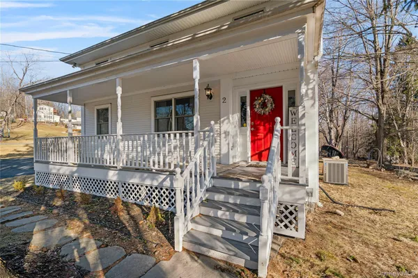 a view of a house with wooden fence