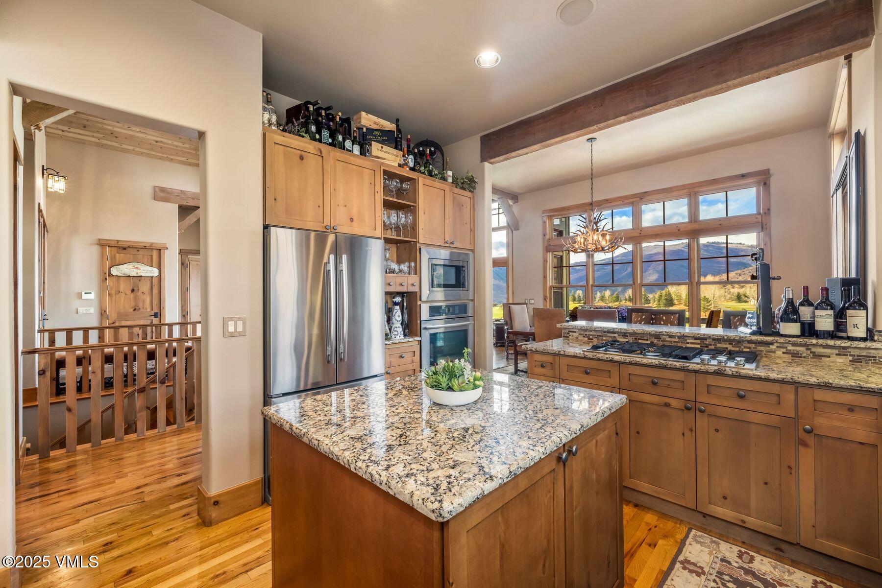 33 Legends Court Edwards, CO 81632 - Photo 23 of 50 a kitchen with stainless steel appliances granite countertop a sink and cabinets