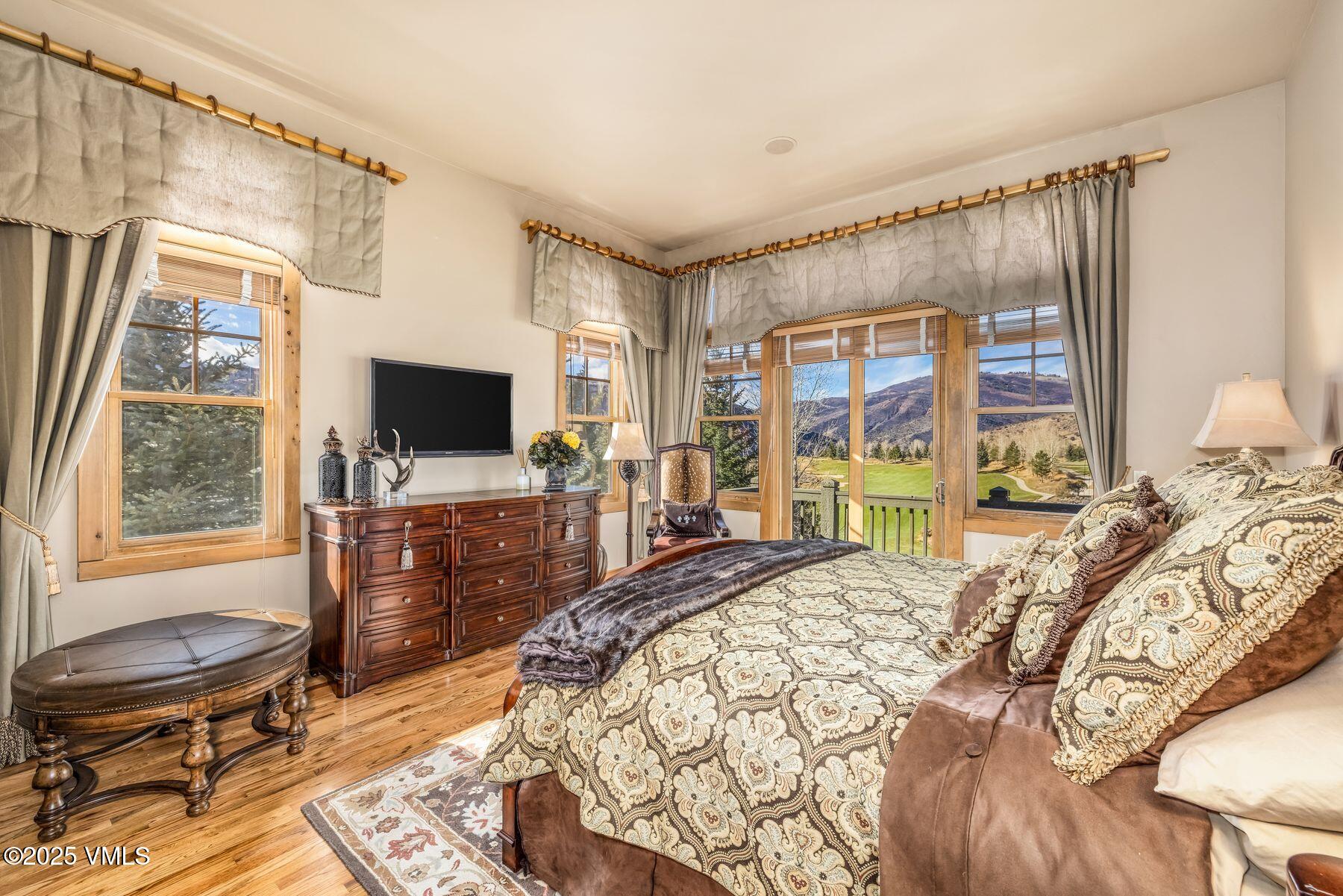 33 Legends Court Edwards, CO 81632 - Photo 28 of 50 a bedroom with a bed and a flat screen tv