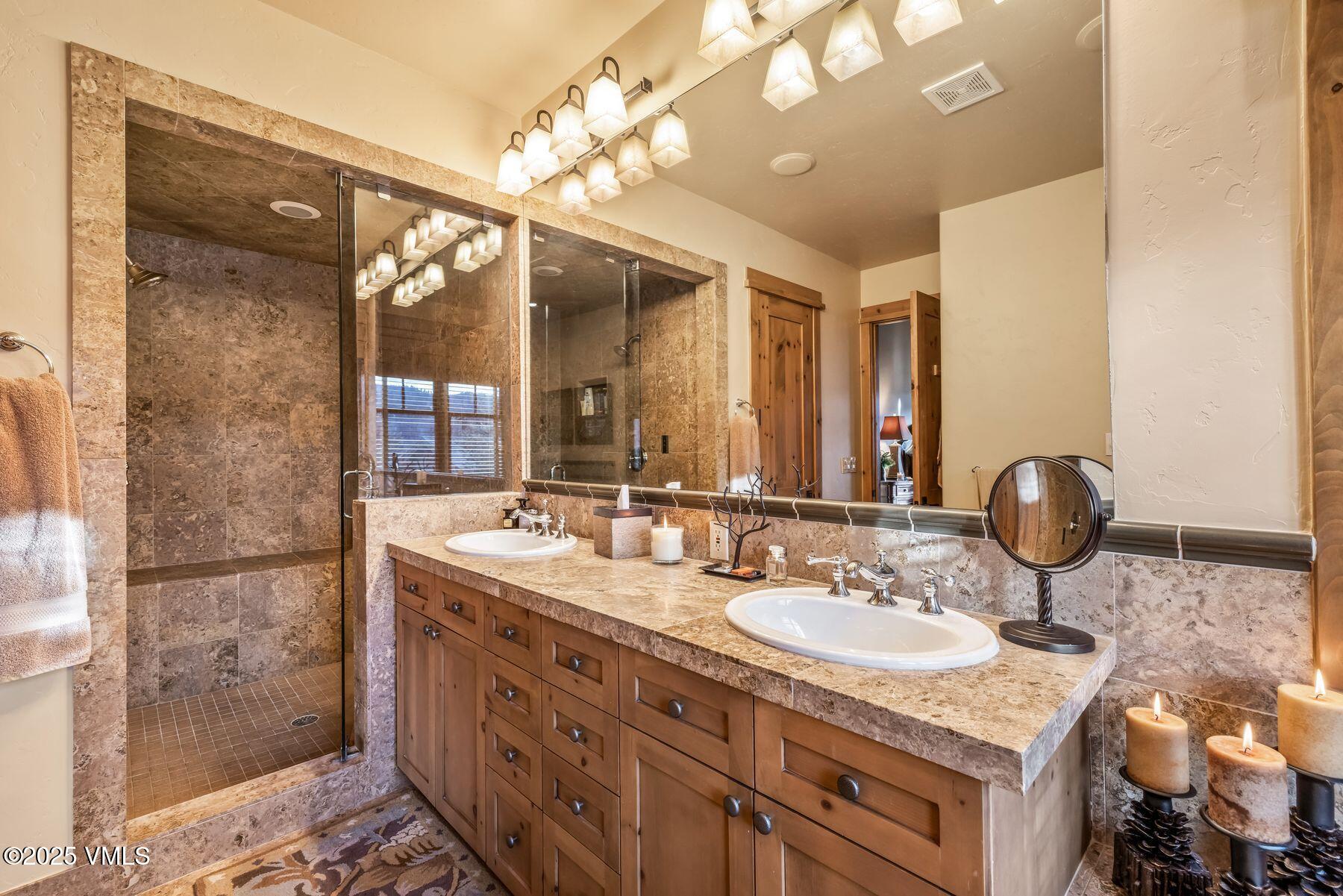 33 Legends Court Edwards, CO 81632 - Photo 29 of 50 a bathroom with a sink double vanity and a mirror