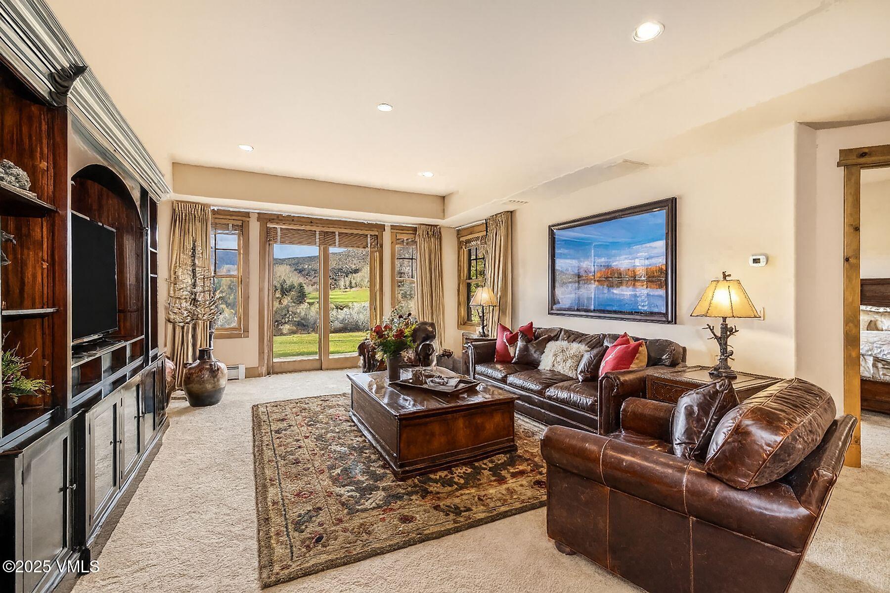 33 Legends Court Edwards, CO 81632 - Photo 30 of 50 a living room with furniture tv and a flat screen tv