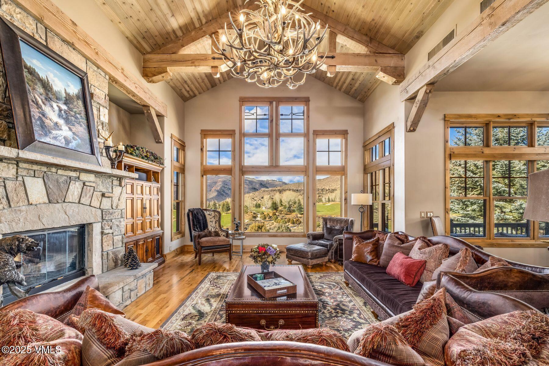 33 Legends Court Edwards, CO 81632 - Photo 3 of 50 a living room with furniture fireplace and a large window