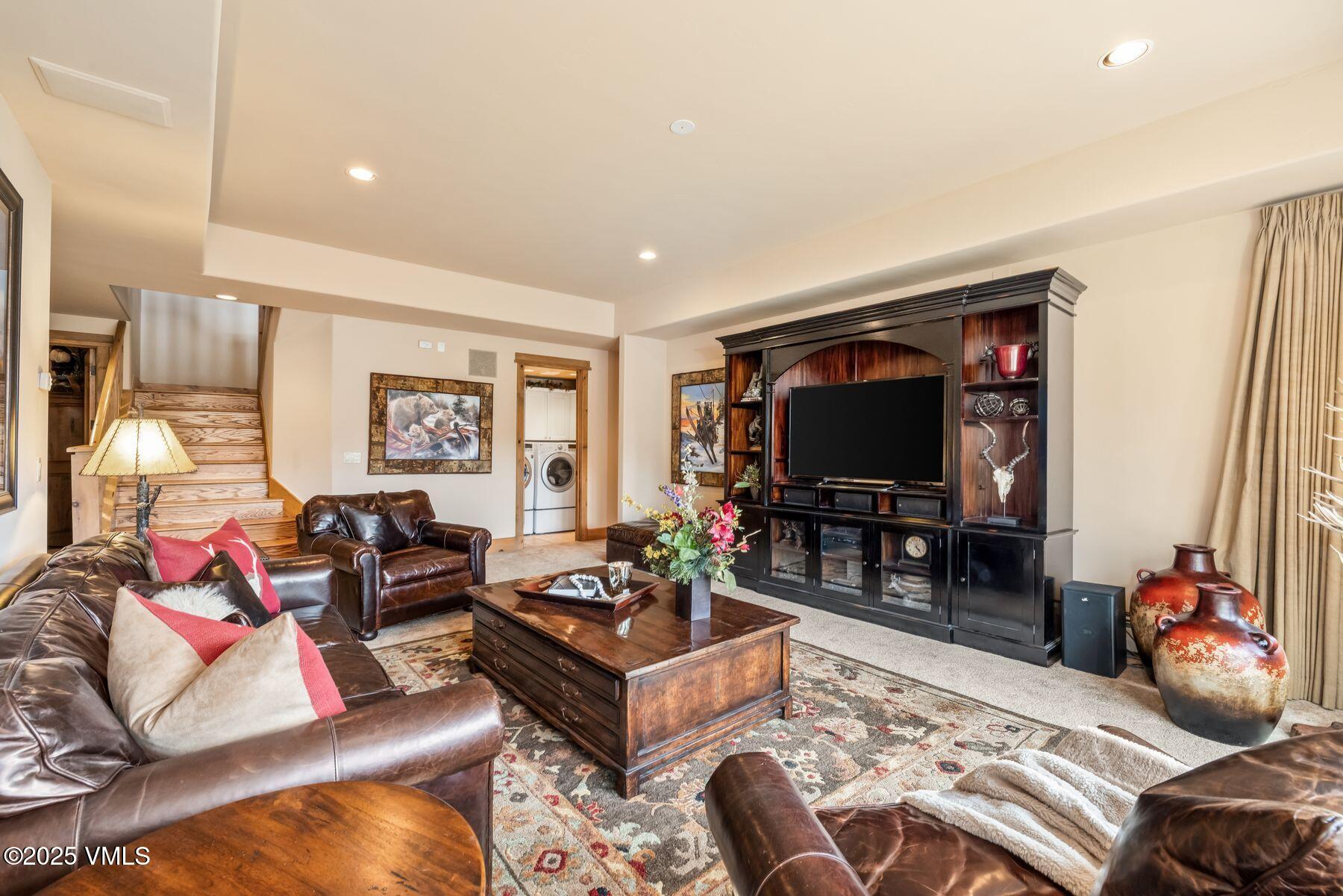 33 Legends Court Edwards, CO 81632 - Photo 31 of 50 a living room with furniture and a flat screen tv