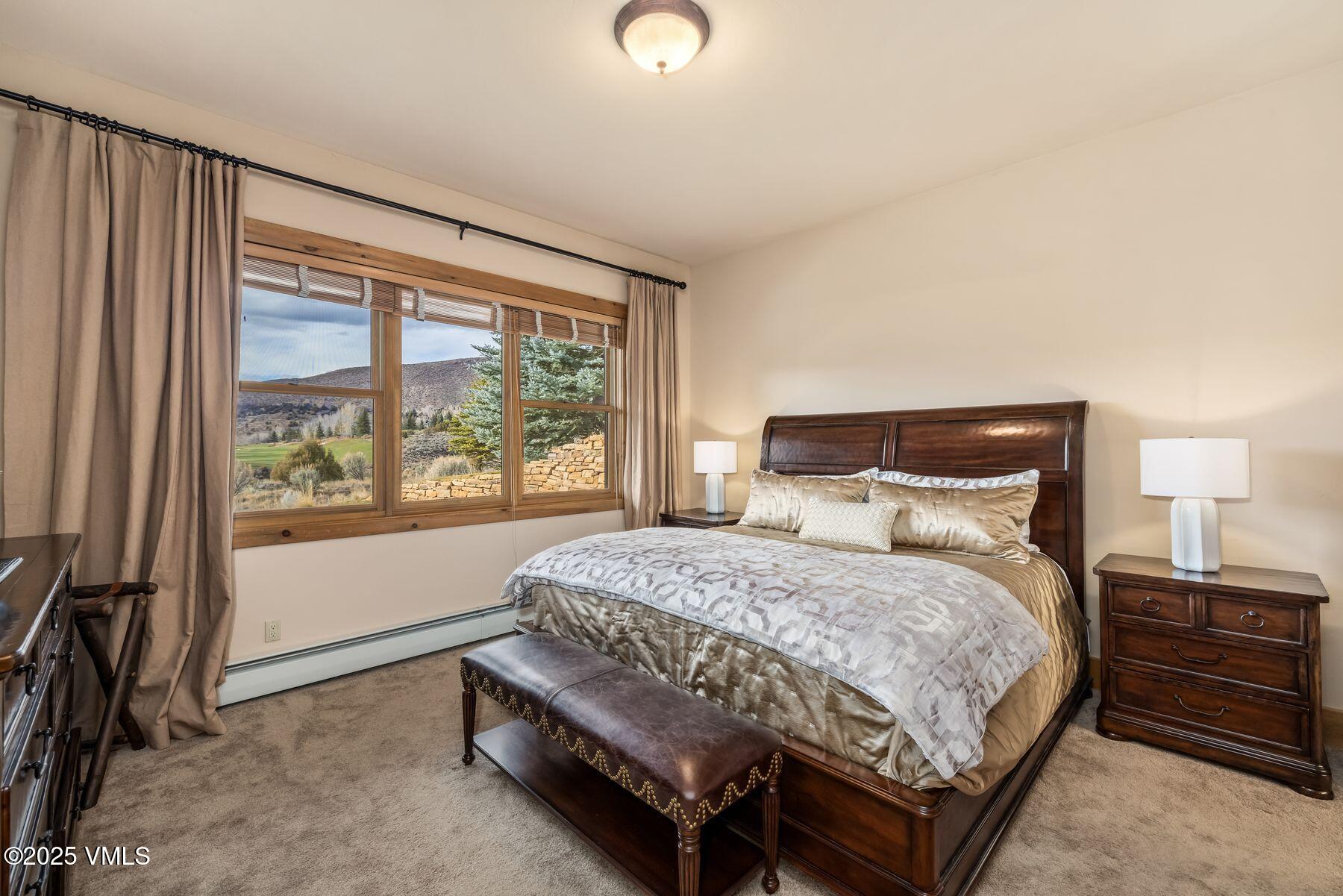 33 Legends Court Edwards, CO 81632 - Photo 32 of 50 a bedroom with a bed and a large window