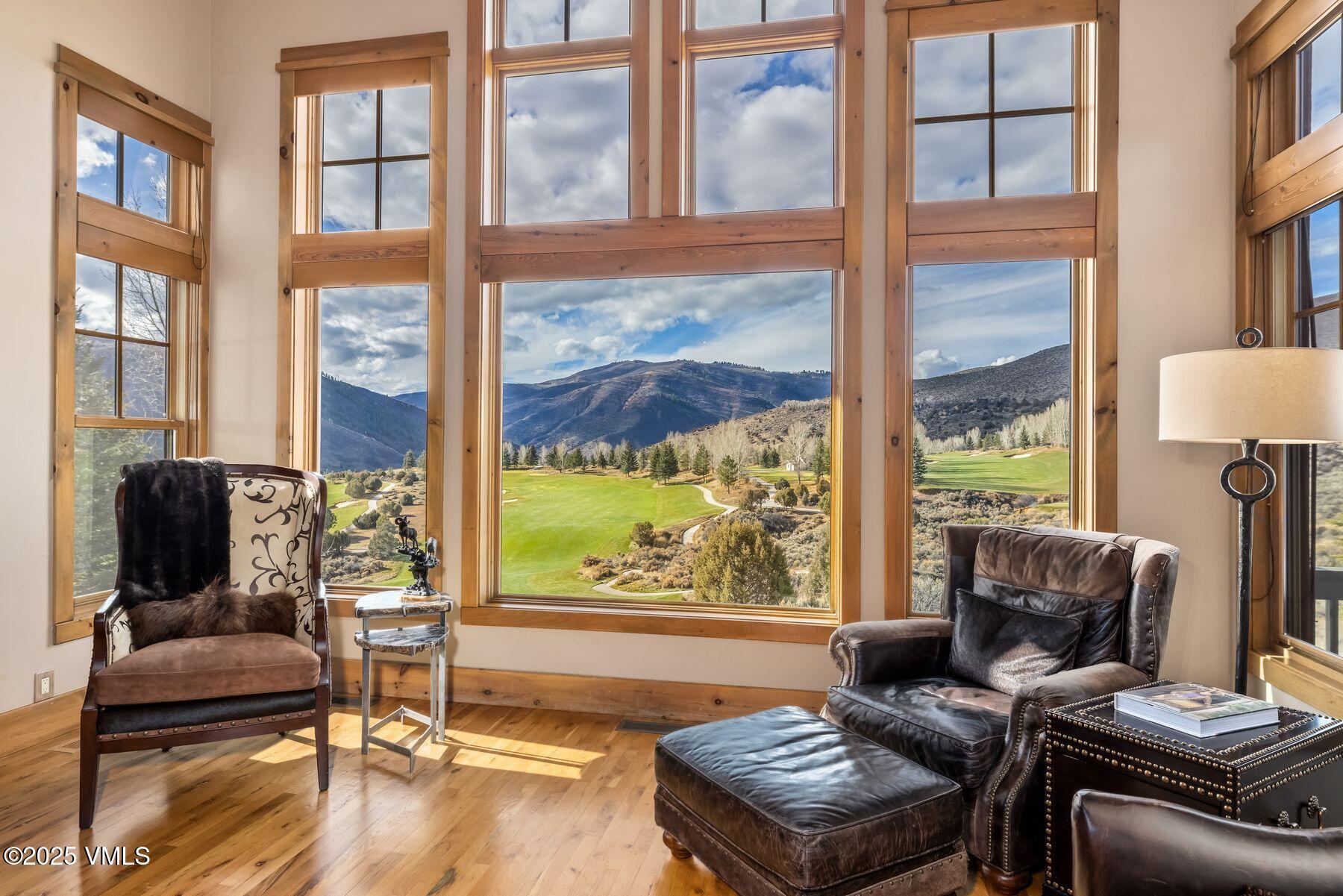 33 Legends Court Edwards, CO 81632 - Photo 4 of 50 a living room with furniture and a floor to ceiling window