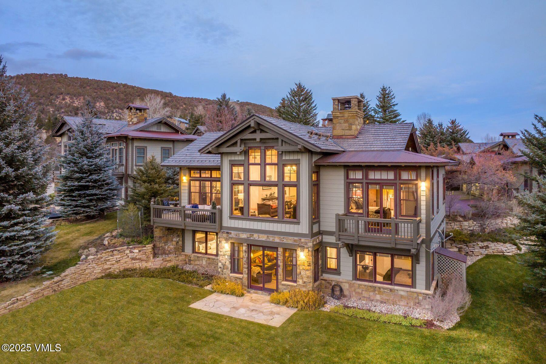 33 Legends Court Edwards, CO 81632 - Photo 41 of 50 a front view of a house with a yard glass top table and chairs