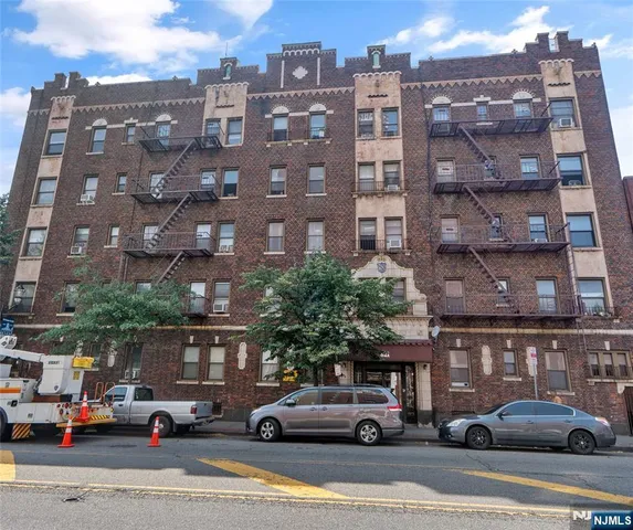 a view of a cars parked in front of a building