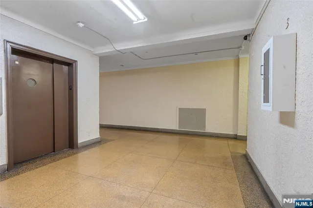 a front view of a building with a glass door