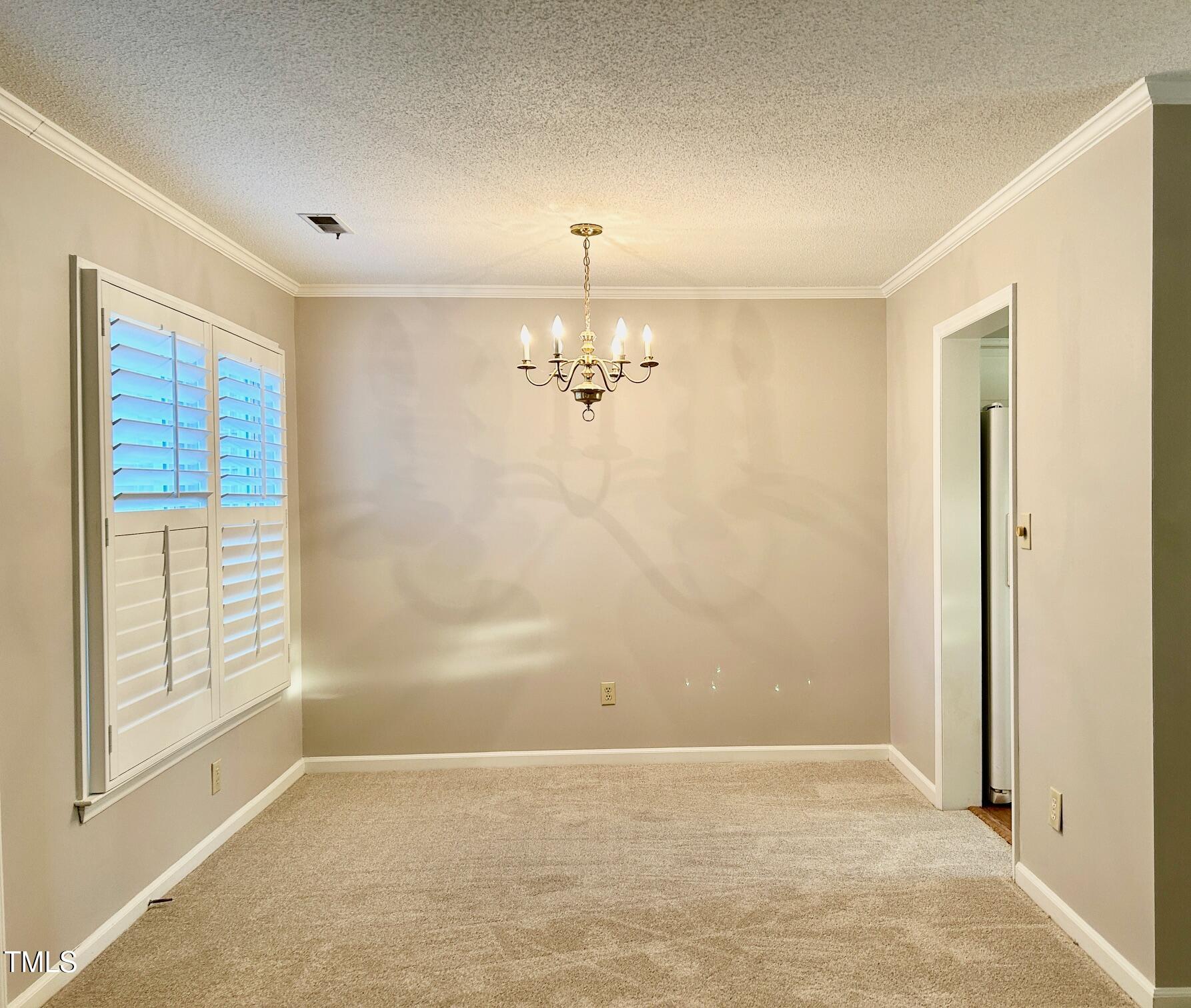 7341 Sweet Bay Lane Raleigh, NC 27615 - Photo 15 of 28 Dining room, plantation shutters, new paint and new carpet