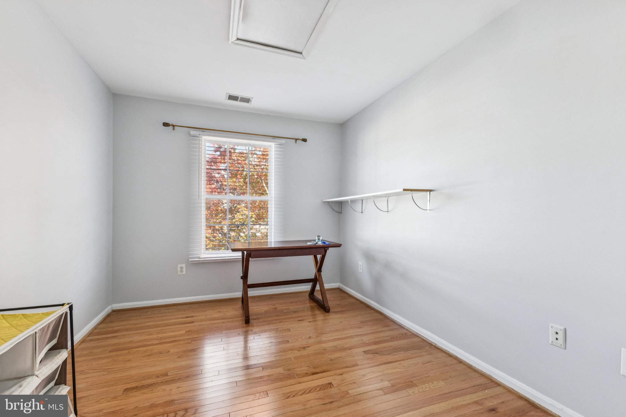 43067 Candlewick Square Leesburg, VA 20176 - Photo 13 of 25 a view of room with hardwood floor and window