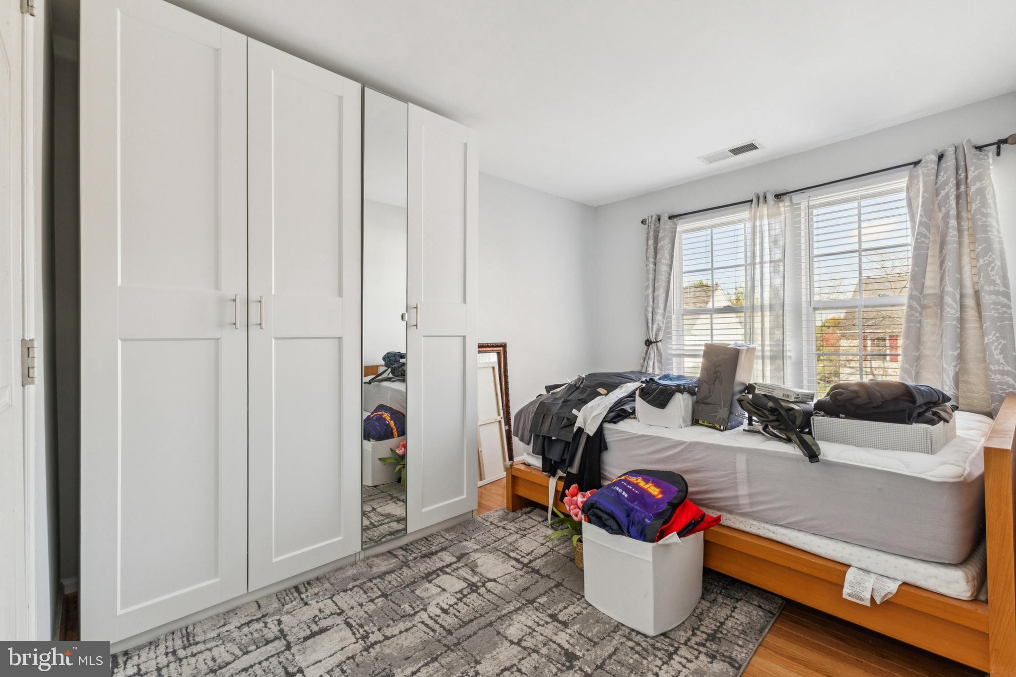43067 Candlewick Square Leesburg, VA 20176 - Photo 15 of 25 a bedroom with a bed and a window
