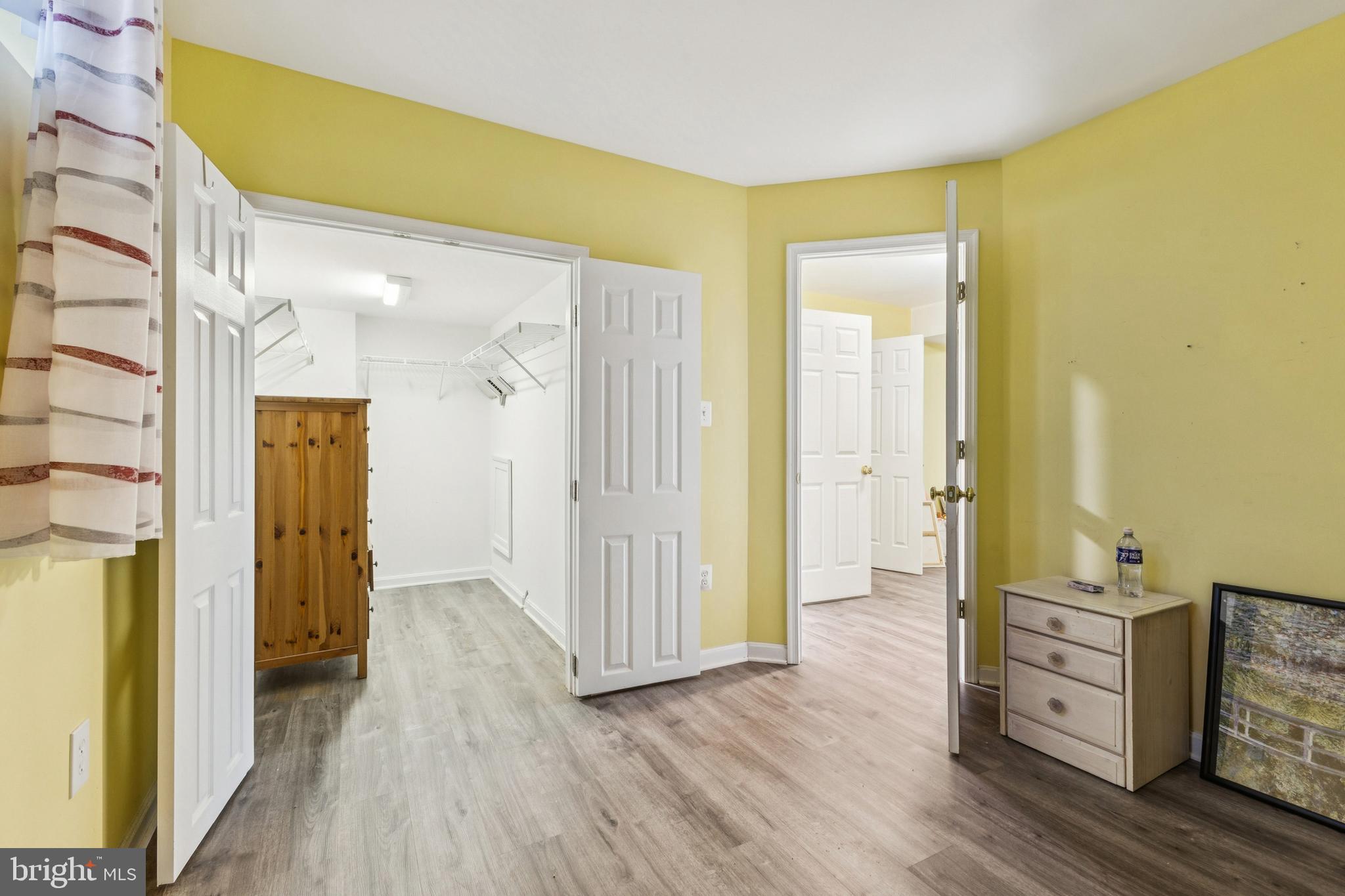 43067 Candlewick Square Leesburg, VA 20176 - Photo 22 of 25 a view of a hallway with wooden floor