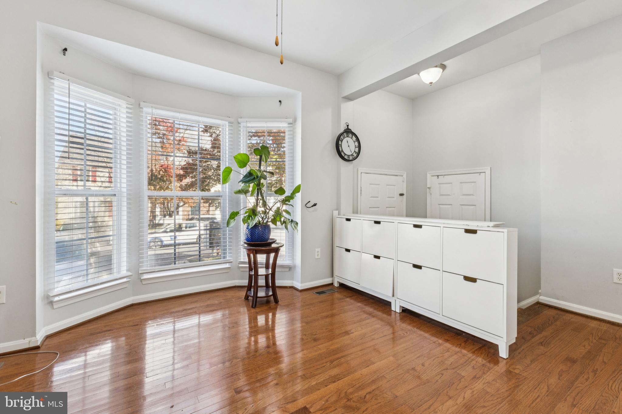 43067 Candlewick Square Leesburg, VA 20176 - Photo 4 of 25 a view of a room with wooden floor and windows