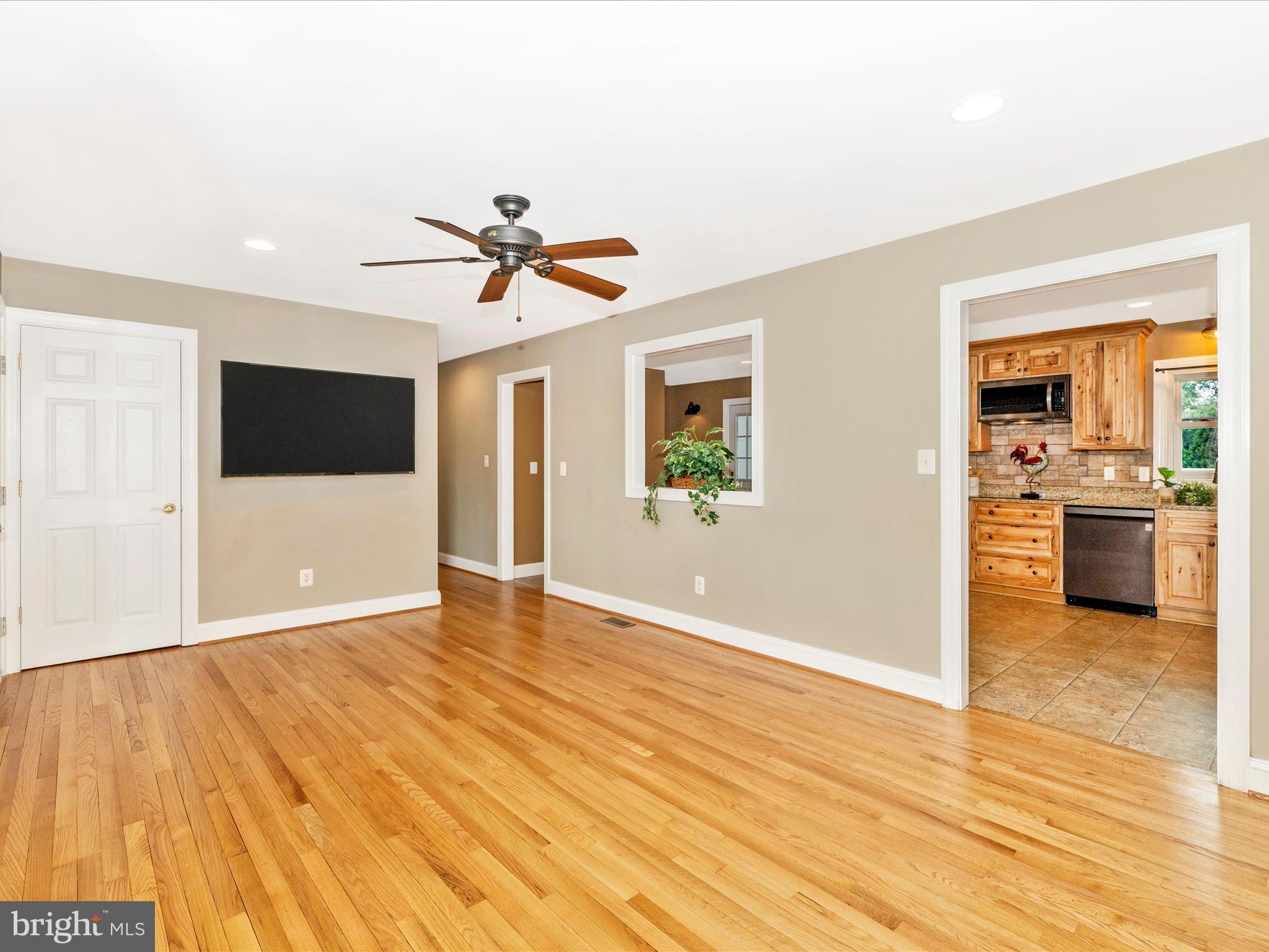 8429 Woodville Road Mount Airy, MD 21771 - Photo 11 of 75 a view of a kitchen with a sink and a microwave