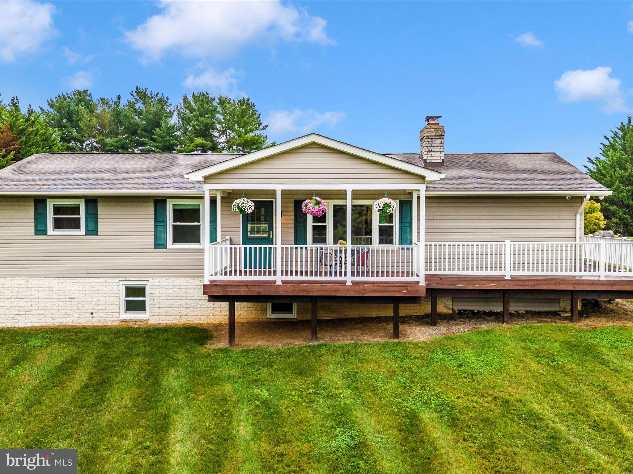 8429 Woodville Road Mount Airy, MD 21771 - Photo 2 of 75 a view of a house with a backyard and a patio