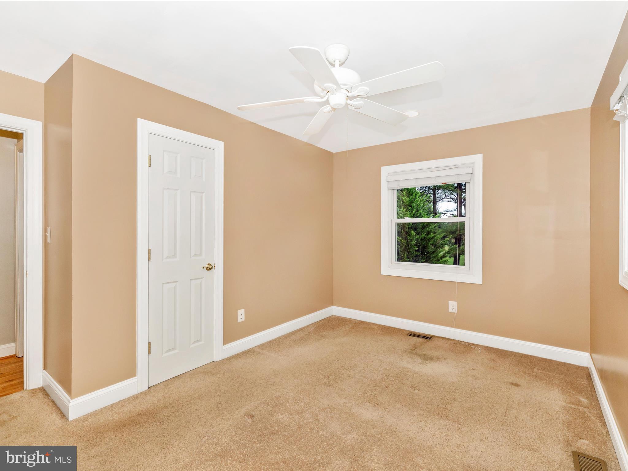 8429 Woodville Road Mount Airy, MD 21771 - Photo 25 of 75 a view of an empty room with a window