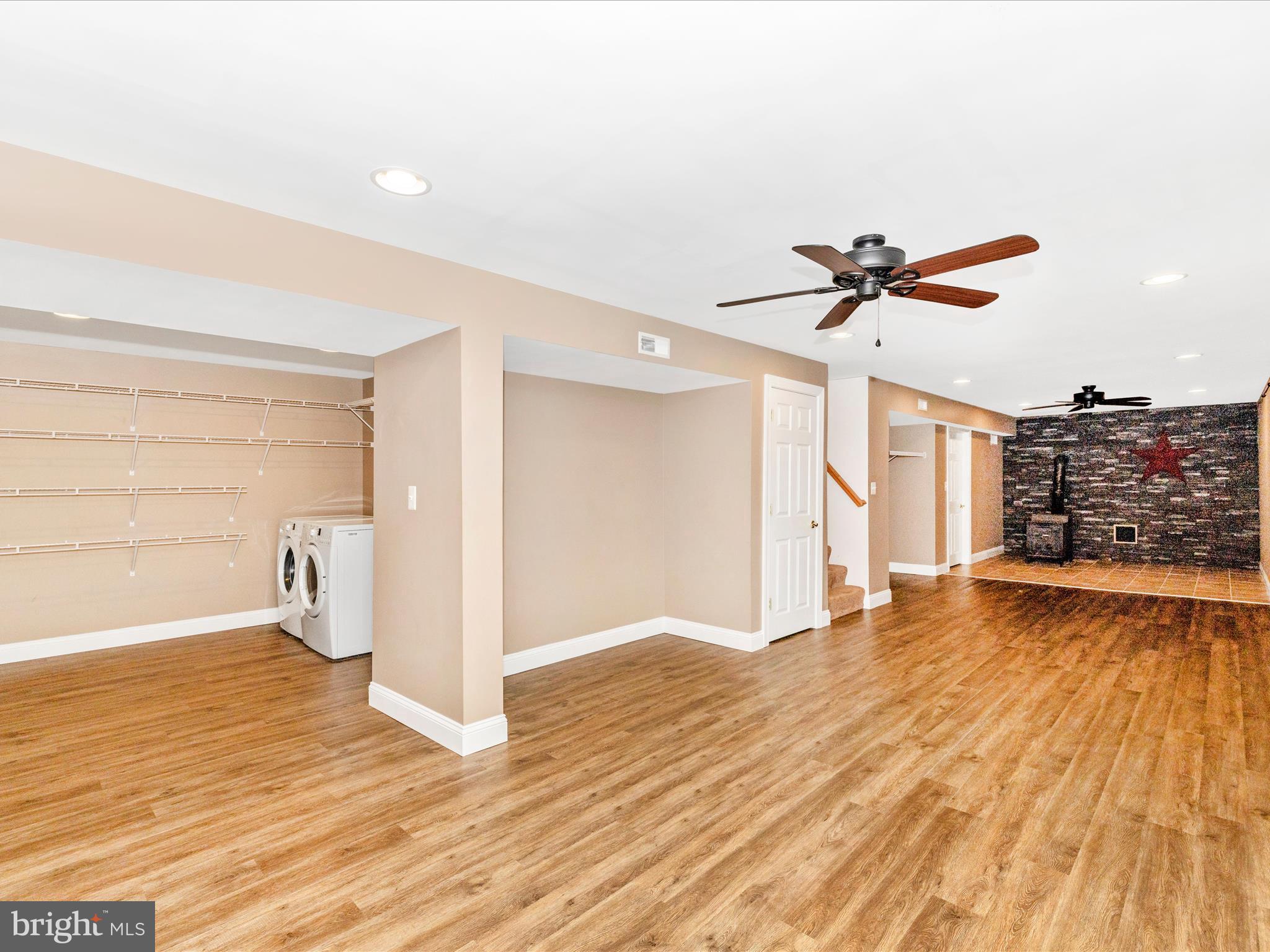 8429 Woodville Road Mount Airy, MD 21771 - Photo 34 of 75 a view of empty room with wooden floor and window