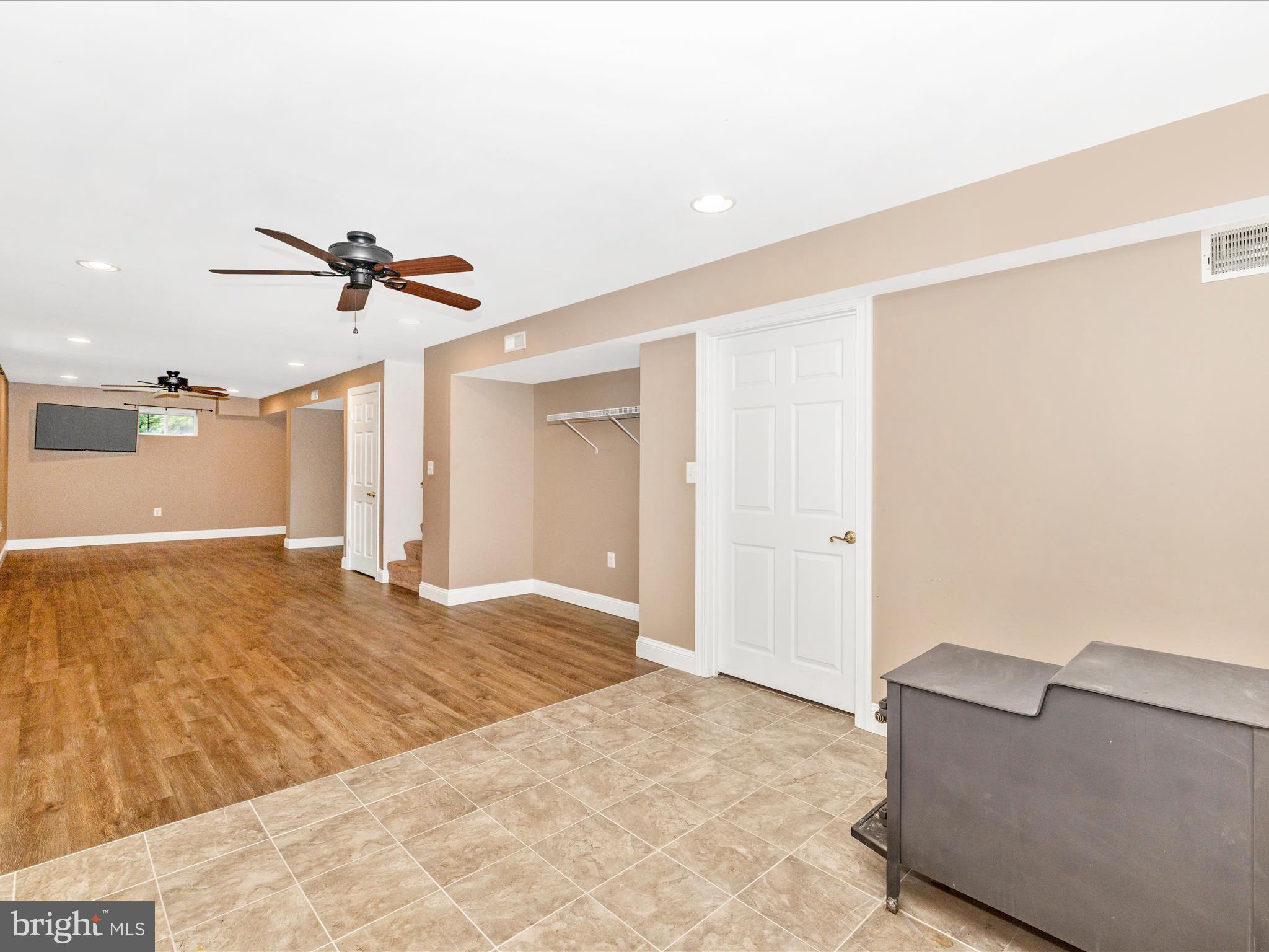 8429 Woodville Road Mount Airy, MD 21771 - Photo 37 of 75 a view of a livingroom with a ceiling fan and window