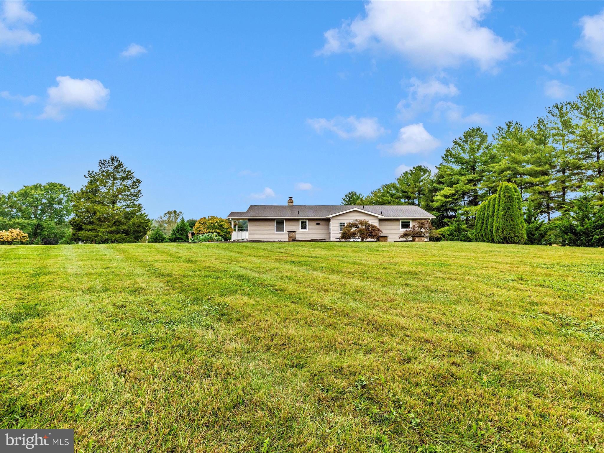 8429 Woodville Road Mount Airy, MD 21771 - Photo 50 of 75 a view of an house with backyard space and balcony