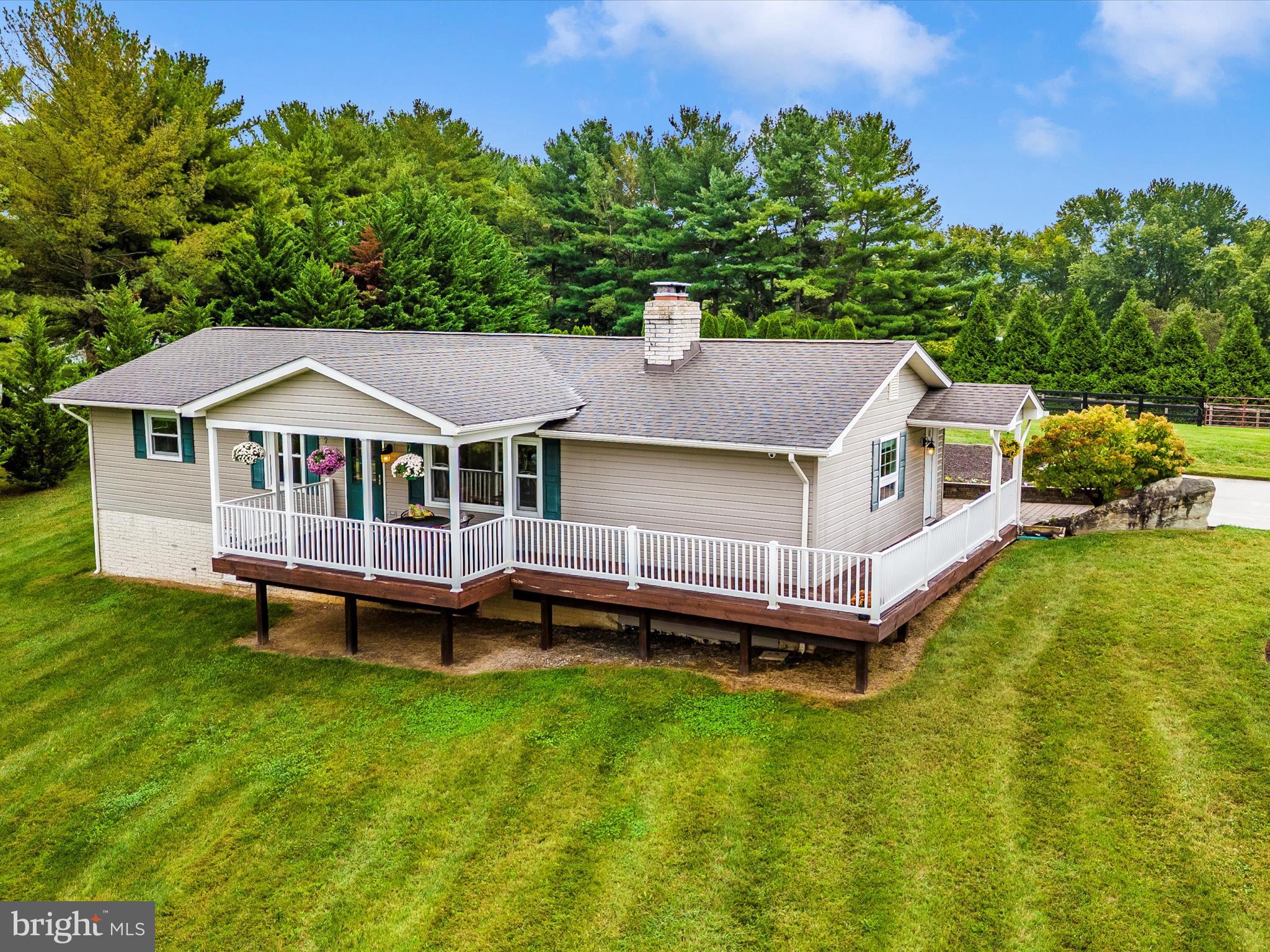 8429 Woodville Road Mount Airy, MD 21771 - Photo 67 of 75 an aerial view of a house with swimming pool a yard and lake view