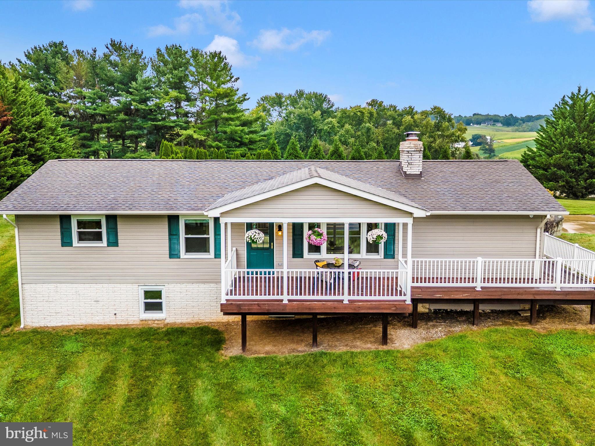 8429 Woodville Road Mount Airy, MD 21771 - Photo 68 of 75 a front view of a house with a garden