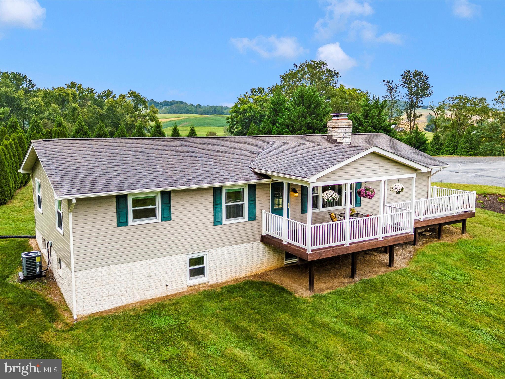 8429 Woodville Road Mount Airy, MD 21771 - Photo 69 of 75 a aerial view of a house with a yard and deck