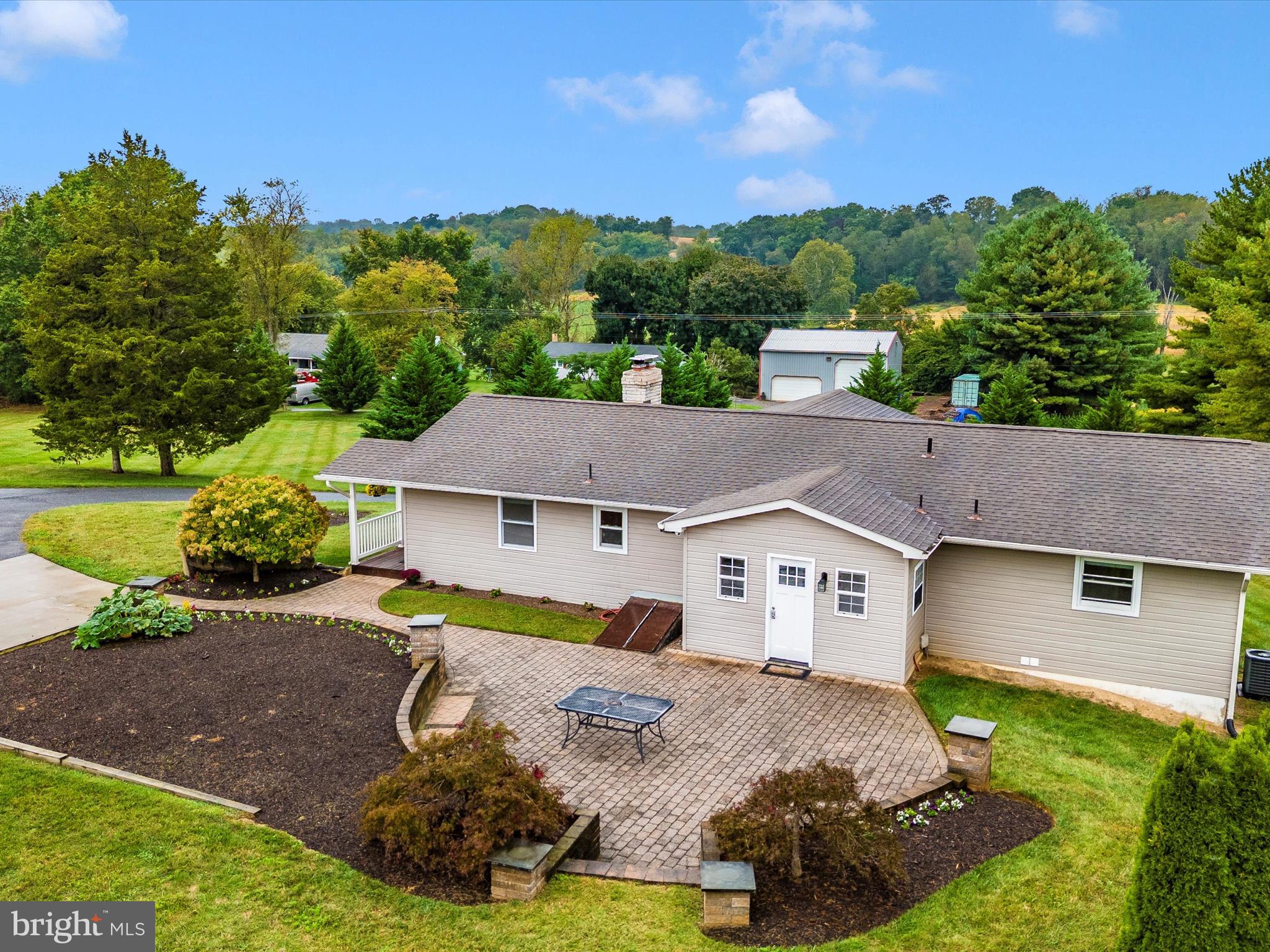 8429 Woodville Road Mount Airy, MD 21771 - Photo 71 of 75 a aerial view of a house with a big yard and large tree