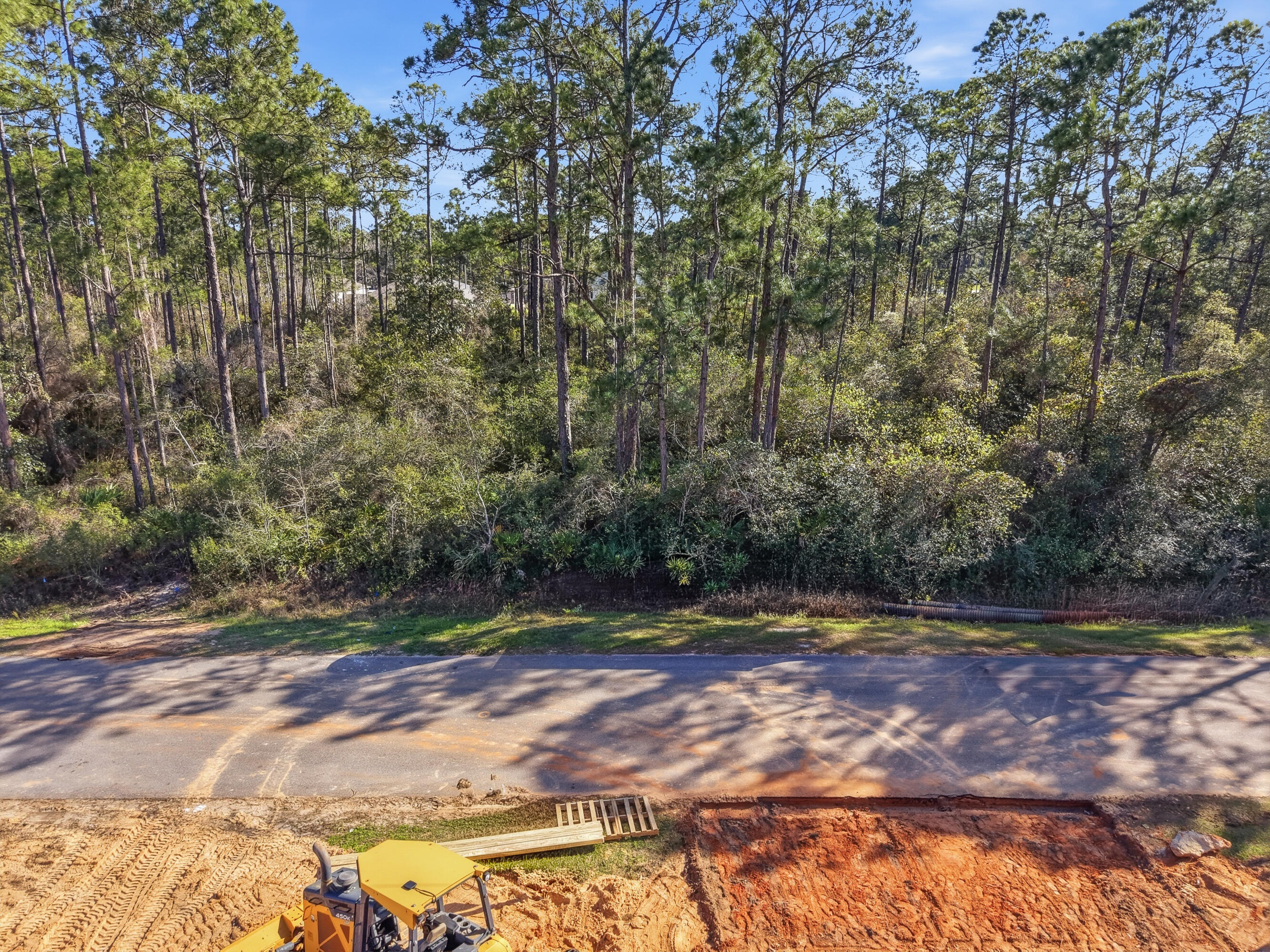 8103 Miranda Street Navarre, FL 32566 - Photo 11 of 12 a view of a yard with large trees