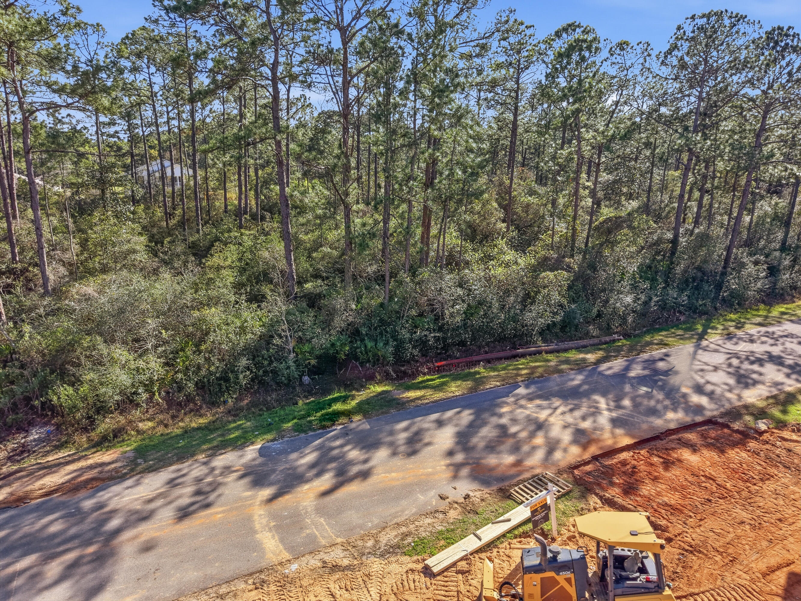 8103 Miranda Street Navarre, FL 32566 - Photo 12 of 12 a view of a yard with plants and trees