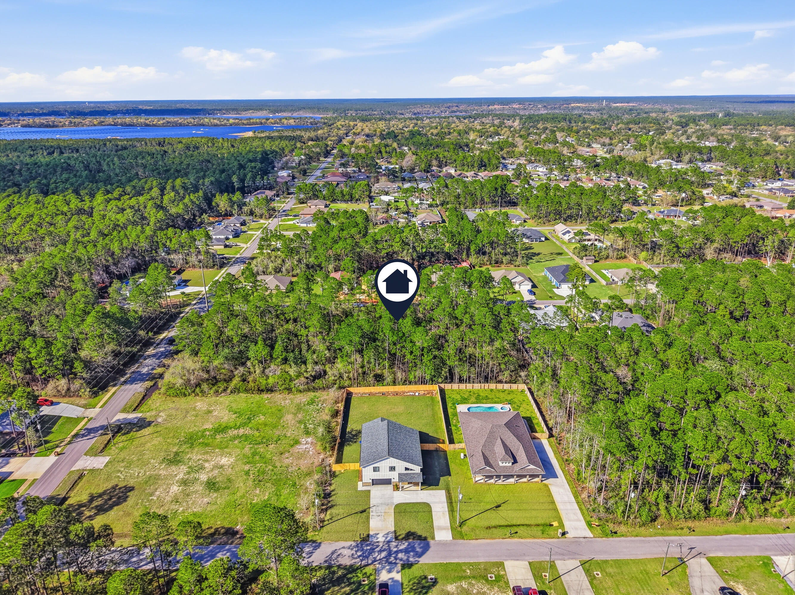8103 Miranda Street Navarre, FL 32566 - Photo 5 of 12 a view of a mini yard with an outdoor space