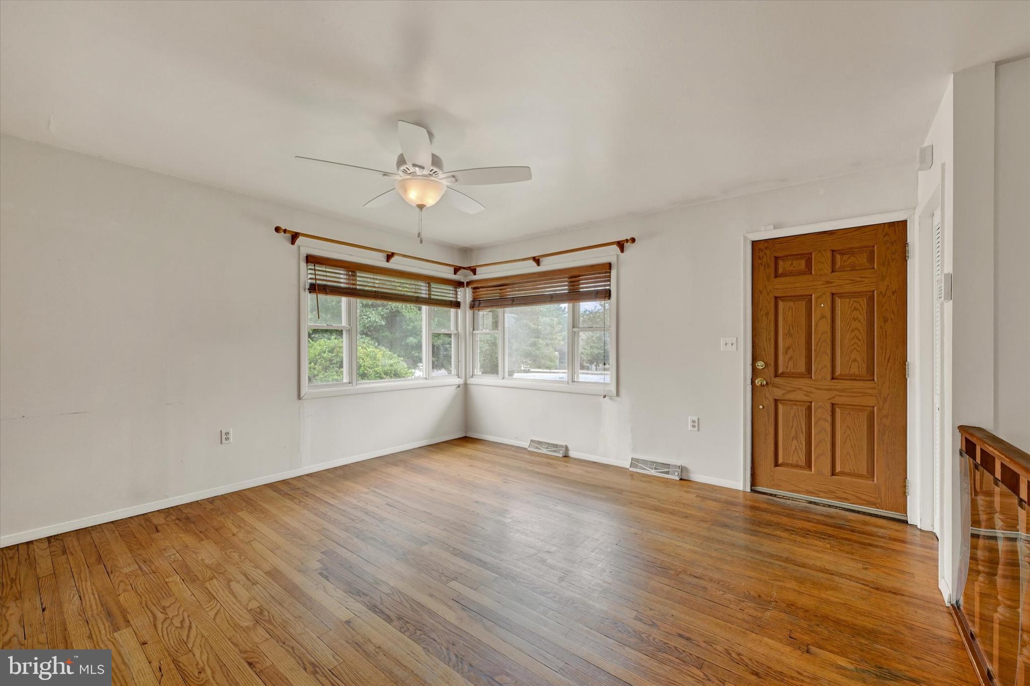 306 Regency Circle Linthicum Heights, MD 21090 - Photo 9 of 73 Sunlit living room with corner windows.