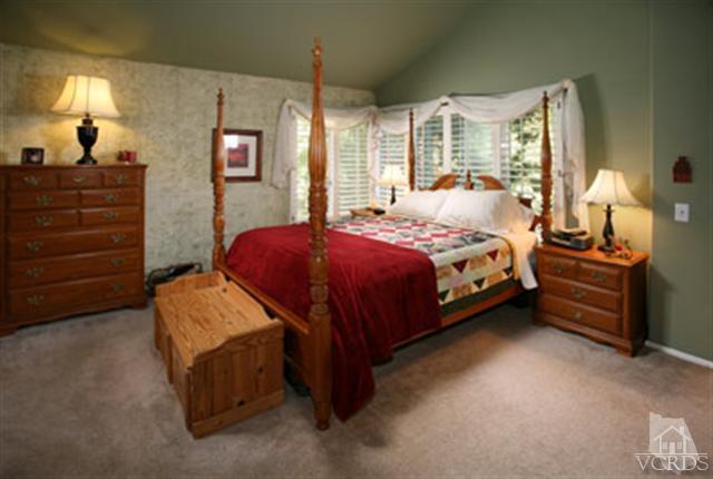 554 Innwood Road Simi Valley, CA 93065 - Photo 12 of 23 a bedroom with a bed and wooden floor
