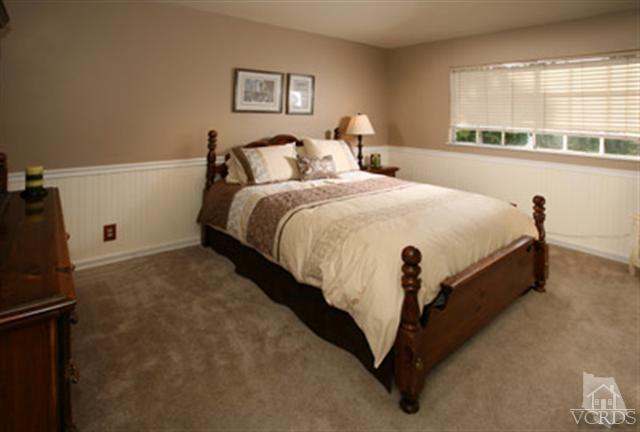554 Innwood Road Simi Valley, CA 93065 - Photo 15 of 23 a spacious bedroom with a bed and a large window