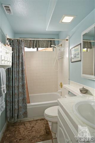 554 Innwood Road Simi Valley, CA 93065 - Photo 17 of 23 a bathroom with a sink toilet and shower
