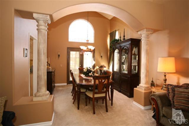 554 Innwood Road Simi Valley, CA 93065 - Photo 6 of 23 a view of a dining room with furniture and a chandelier