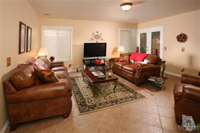 554 Innwood Road Simi Valley, CA 93065 - Photo 8 of 23 a living room with furniture and a flat screen tv