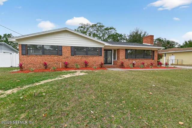 front view of a house with a yard