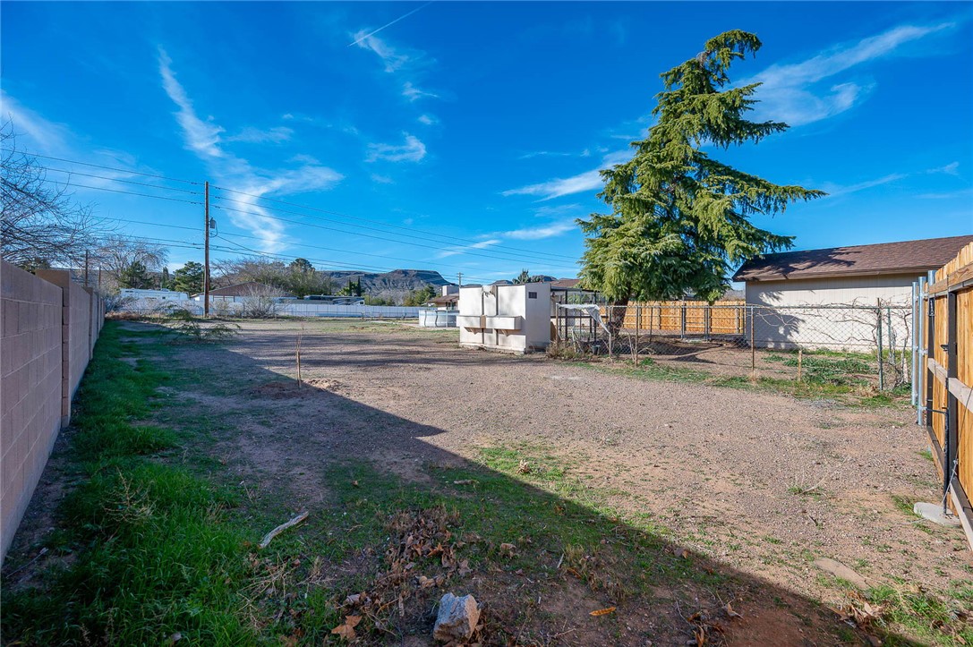 630 Riata Valley Road Kingman, AZ 86409 - Photo 52 of 96 Fenced backyard featuring an outbuilding