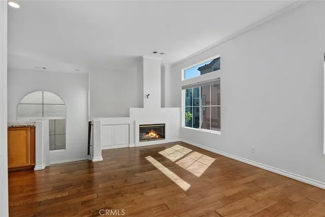 a view of livingroom with hardwood floor and a fireplace