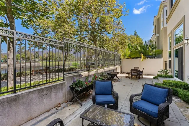 a view of a chairs and tables in the backyard