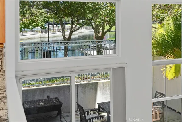 a view of a two chairs in the balcony