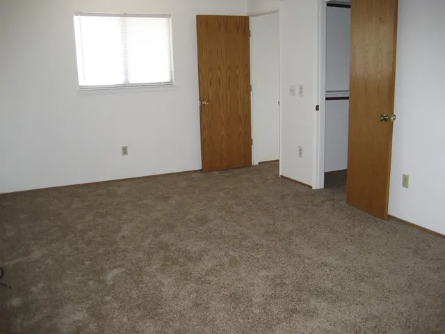 a bathroom with a bathtub shower sink vanity and toilet