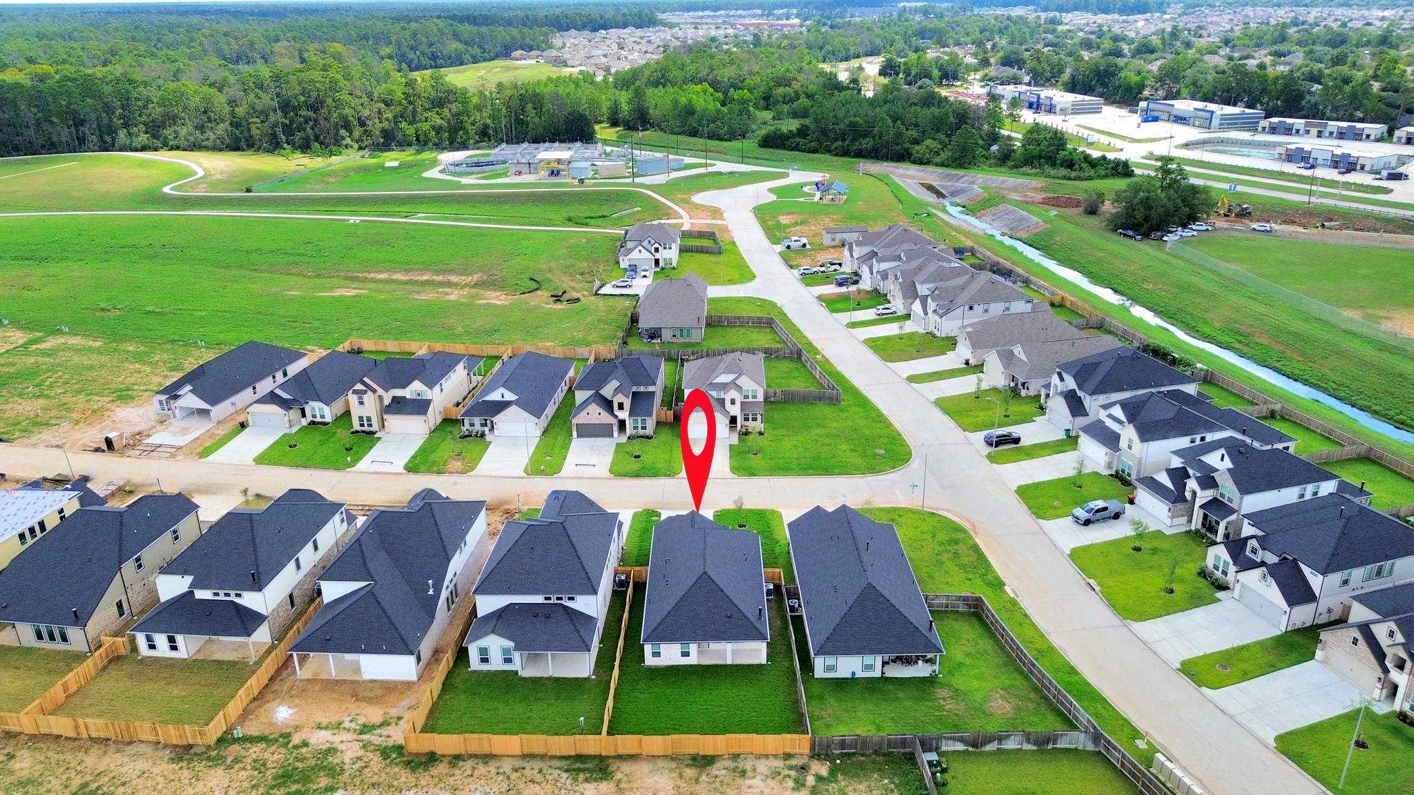 24507 Broad Park Spring, TX 77373 - Photo 4 of 37 An aerial view of a spacious subdivision lot, highlighting a well-maintained yard and a fully fenced perimeter, offering both privacy and expansive outdoor space.